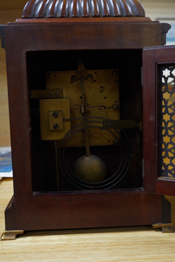 An early 20th century mantel clock, the dial inscribed J W Benson Ltd, London, with pendulum and key, 41cm high. Condition - fair, untested